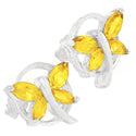 Butterfly-shaped earrings with yellow stones on a white background